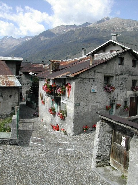 Bormio is a typically beautiful Alpine town, with ancient stone houses, their gray exteriors enlivened by bright flowers