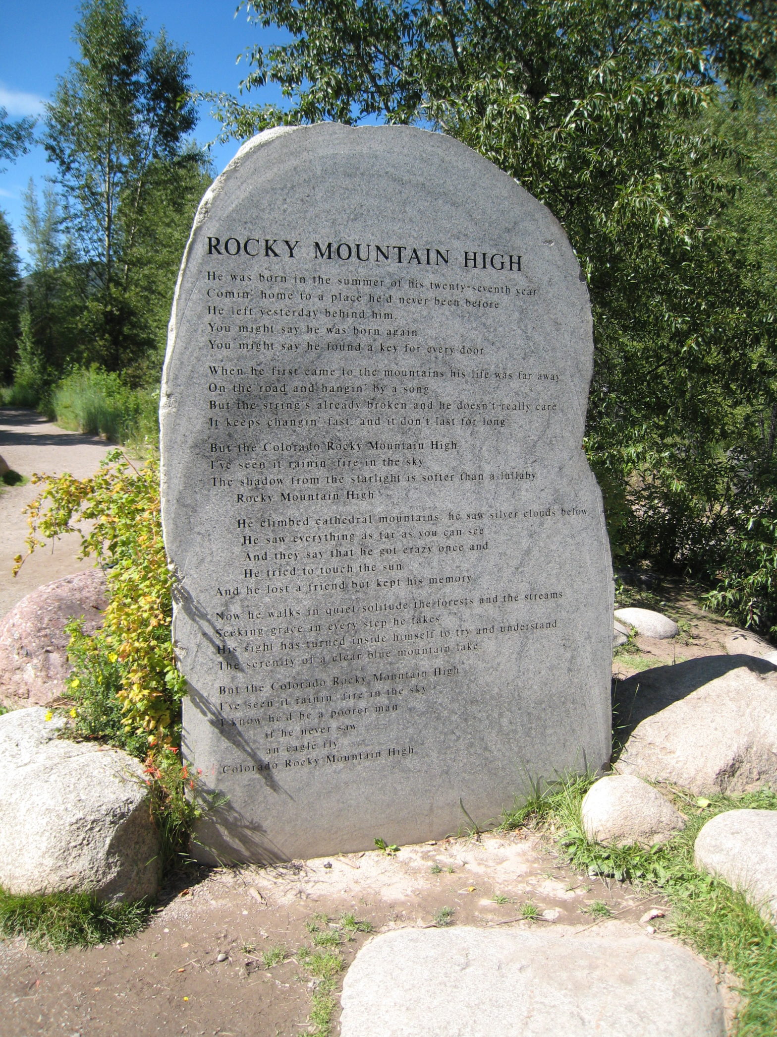 lyrics to John Denver's "Rocky Mountain High" carved into a rock in Aspen, CO