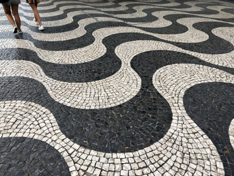 streets paved in a black and white wave pattern, Lisbon.