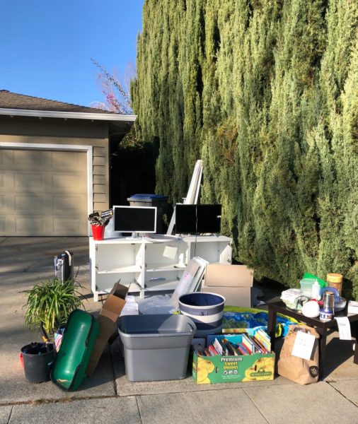 books, furniture, etc. piled up to give away