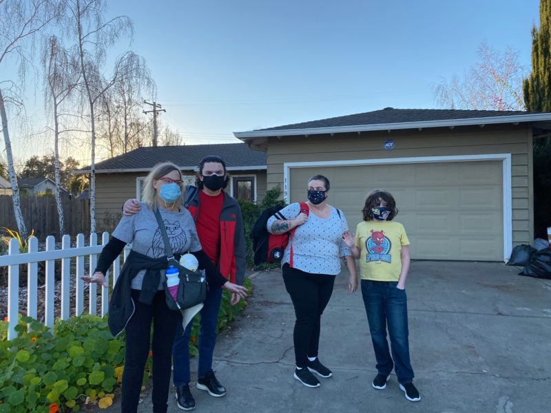 Deirdré, Brendan, Claire, and Mitchell in the driveway, about to leave