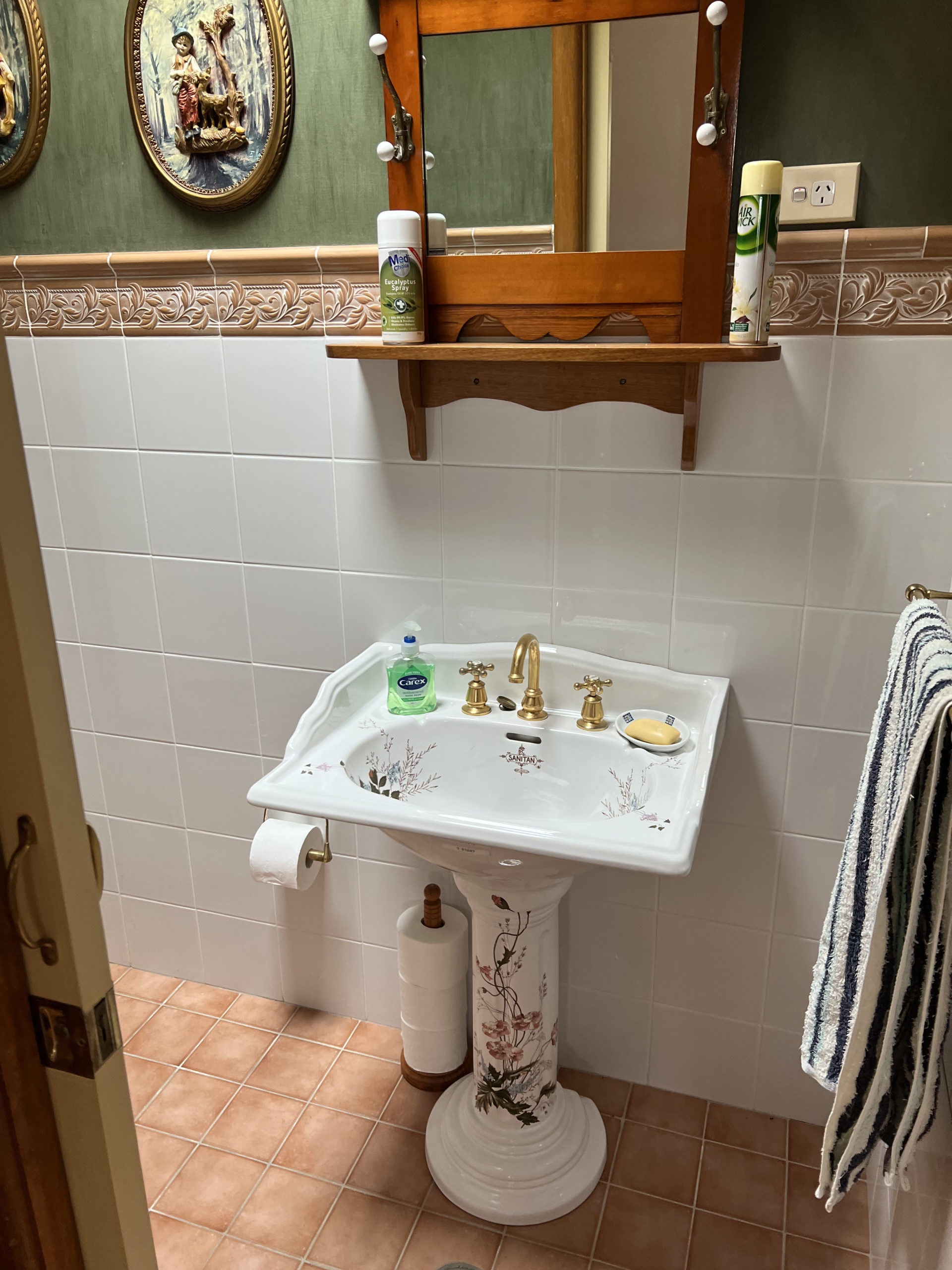 floral decorated sink and fancy bathroom tiles