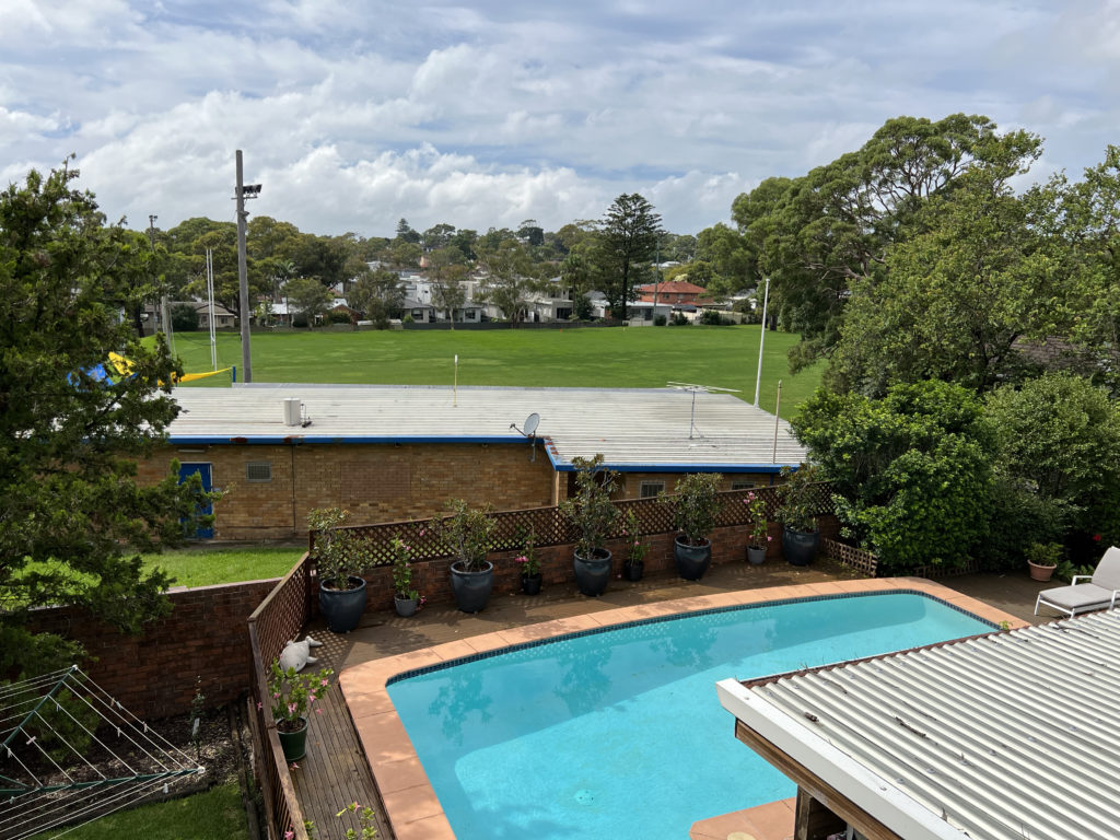 backyard and pool looking onto rugby club