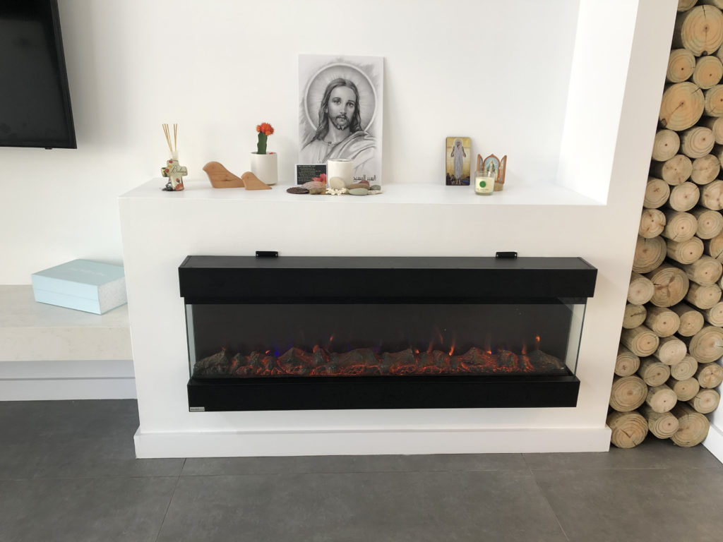 fireplace with a classic picture of white Jesus