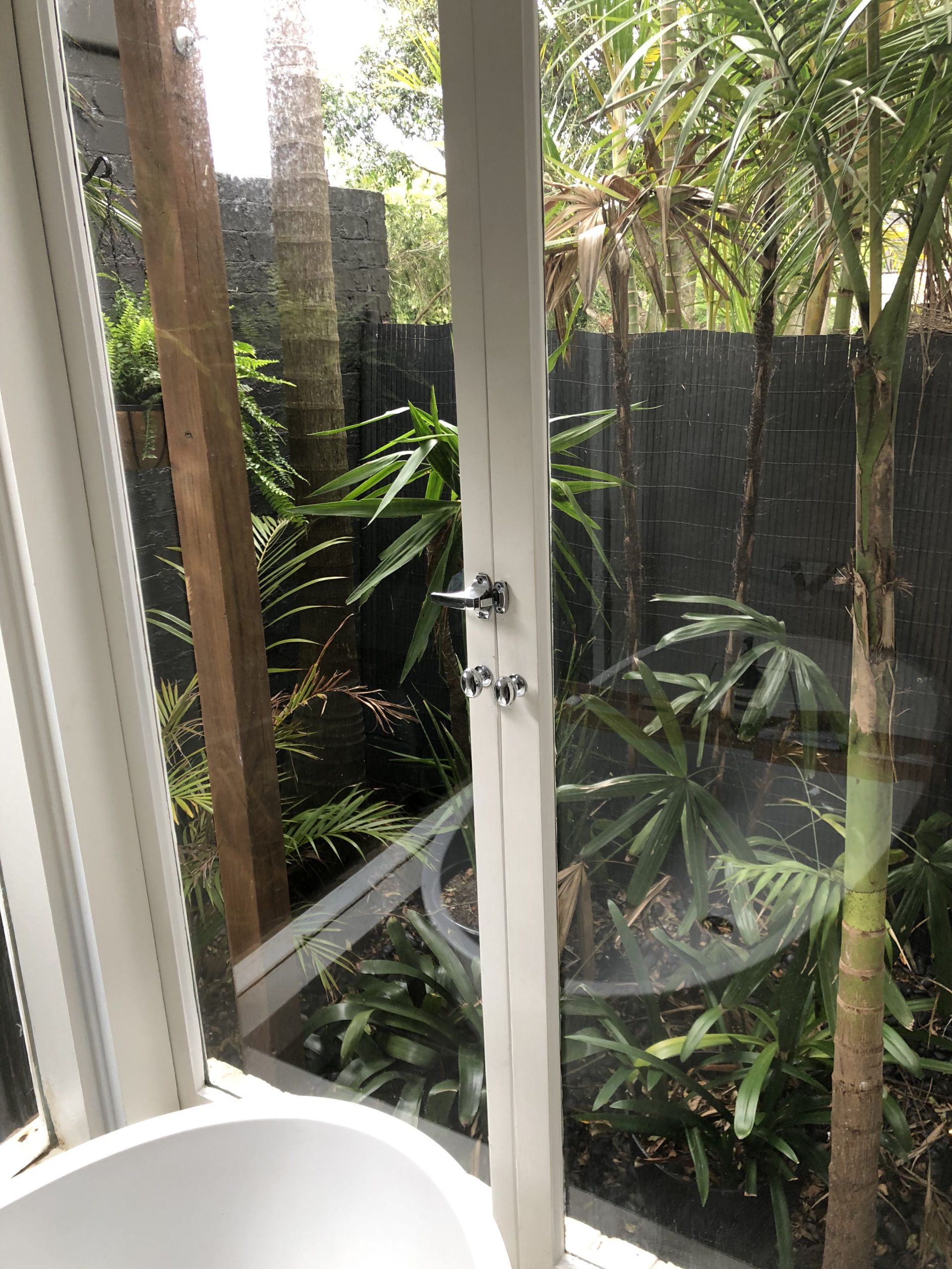 shower area looking onto a private garden