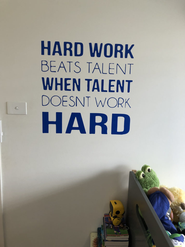 quote painted onto child's bedroom wall "Hard work beats talent when talent doesn't work HARD"