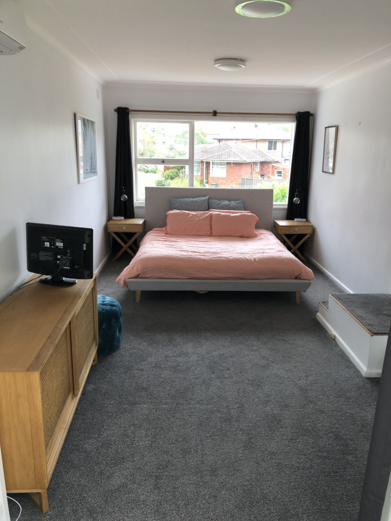 bedroom squeezed into a mismatched house addition