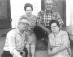 B&W photo of my grandfather (Alton), grandmother (Lillian) and her brother and sister in law, Louis and Ada, sitting on a front stoop. Lillian looks grim, Ada and Louis look faintly amused, hard to read my grandfather's expression